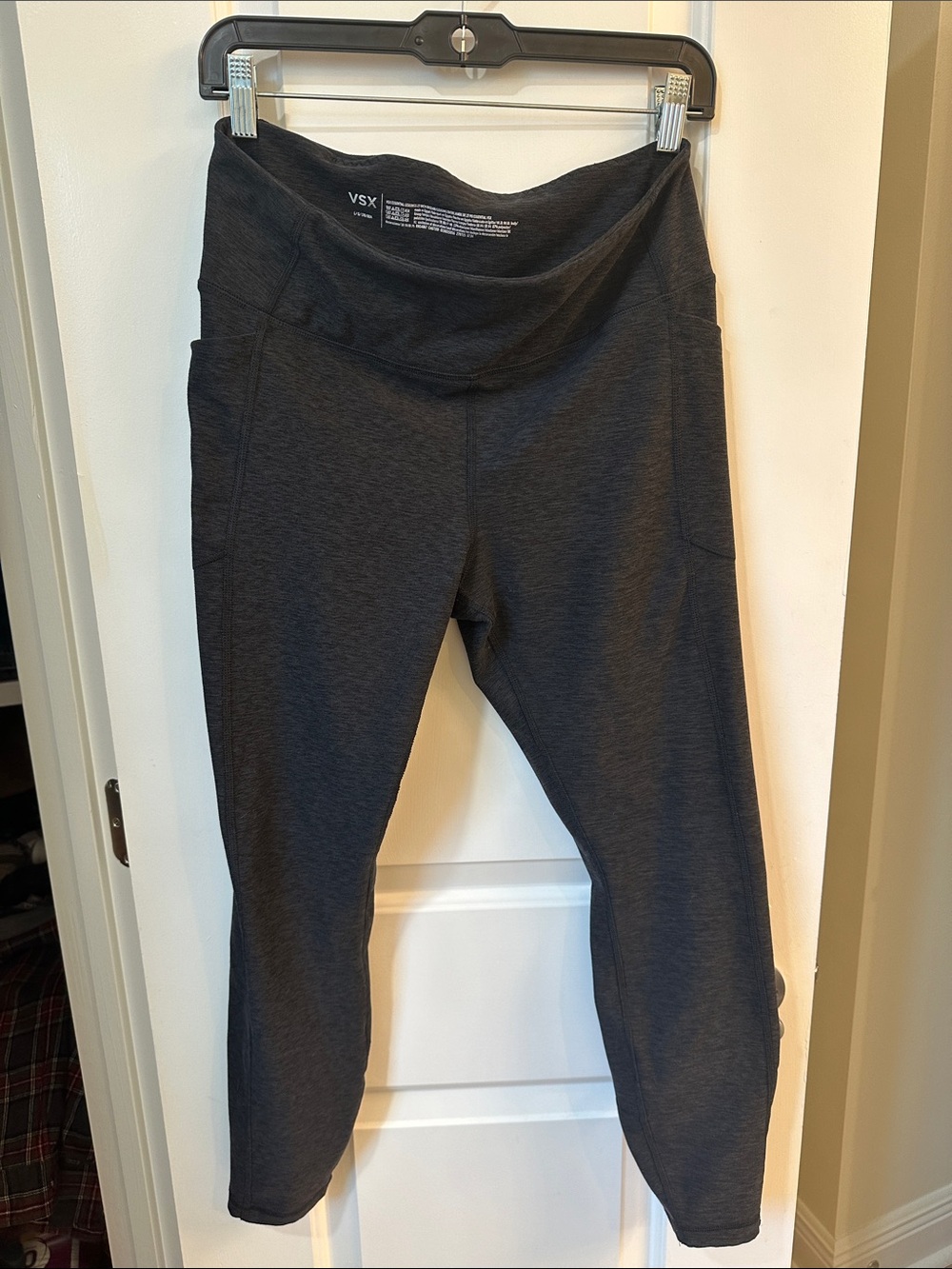 Victoria's Secret VSX black high-waisted leggings featuring side pockets.